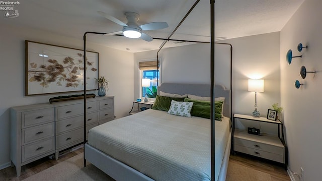 bedroom featuring ceiling fan and light hardwood / wood-style floors