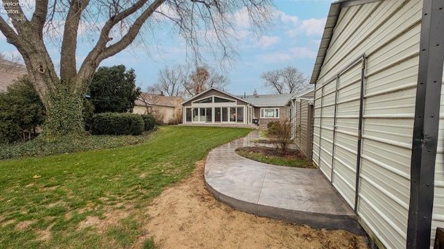 view of yard featuring a sunroom