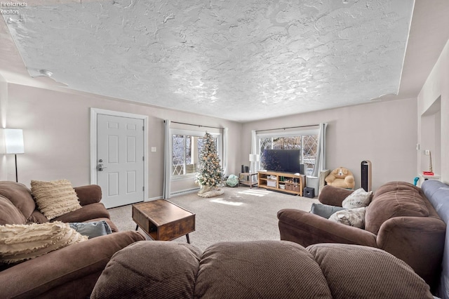 carpeted living room featuring a textured ceiling