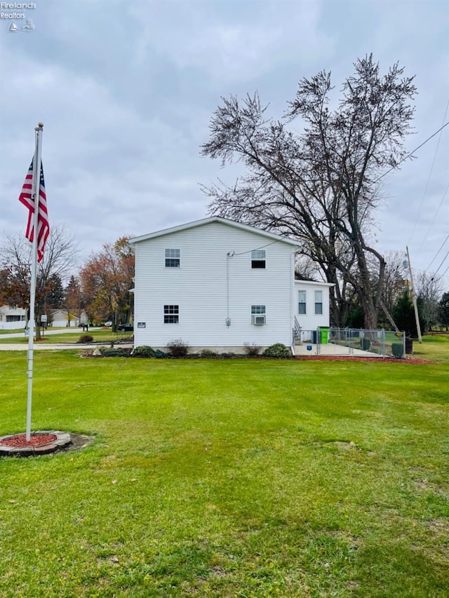 view of home's exterior featuring a yard