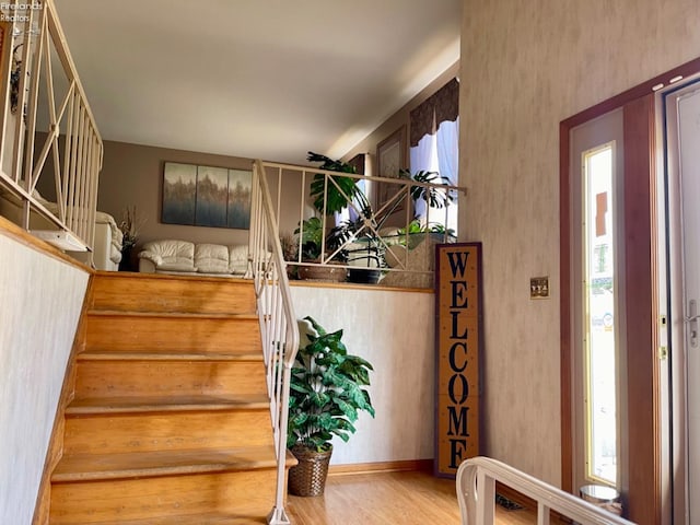 staircase featuring wood-type flooring