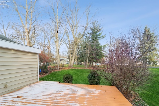 wooden deck with a yard