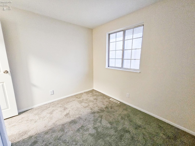 spare room featuring carpet flooring