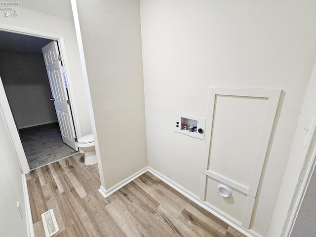 laundry area featuring washer hookup and light wood-type flooring