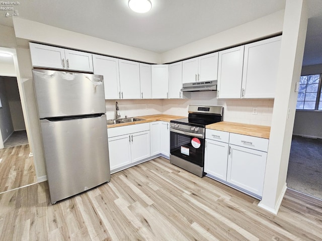 kitchen with white cabinetry, sink, stainless steel appliances, light hardwood / wood-style flooring, and butcher block countertops