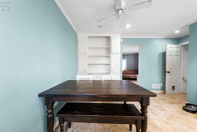 dining area featuring ceiling fan and ornamental molding