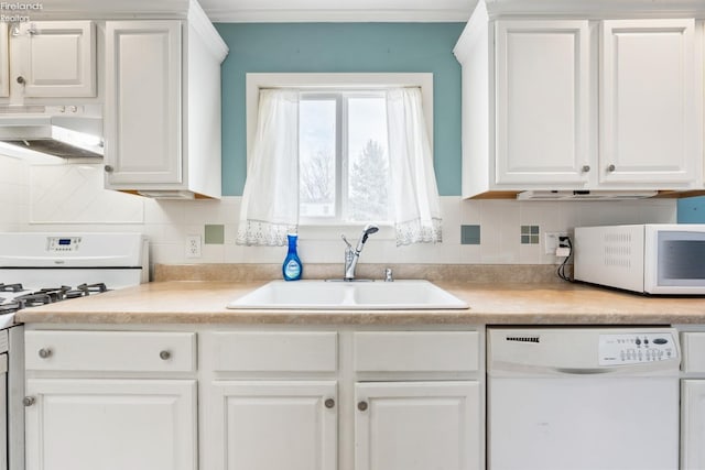 kitchen with white cabinetry, sink, ventilation hood, crown molding, and white appliances