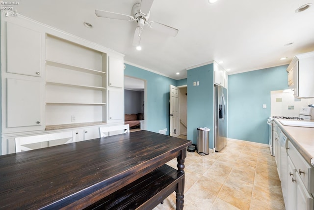 kitchen with white cabinets, crown molding, stainless steel refrigerator with ice dispenser, ceiling fan, and tasteful backsplash