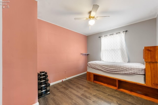 bedroom with ceiling fan and hardwood / wood-style flooring