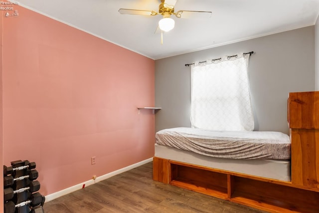 bedroom with hardwood / wood-style flooring and ceiling fan