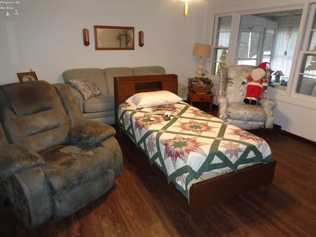 bedroom featuring dark hardwood / wood-style flooring