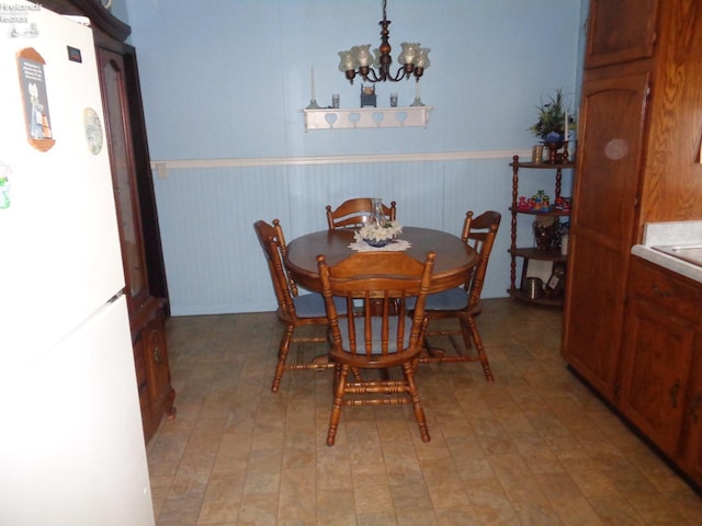 dining area with a chandelier