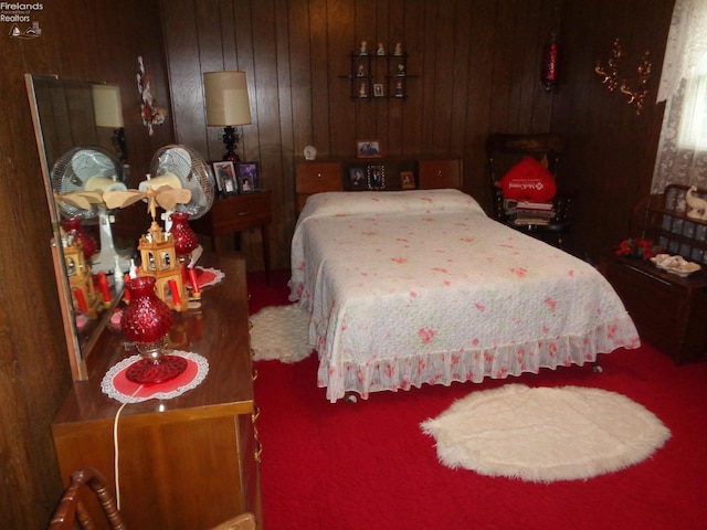 bedroom with wooden walls