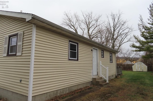 view of property exterior featuring a storage unit