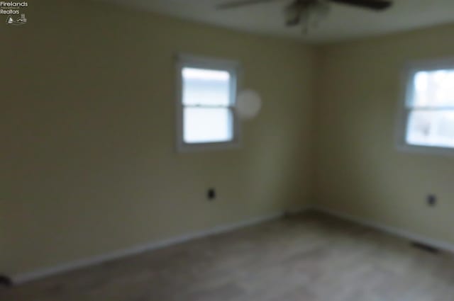 empty room featuring ceiling fan