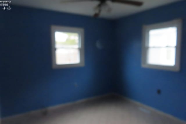 spare room with ceiling fan