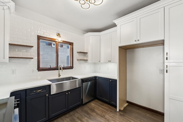 kitchen with dishwasher, sink, dark hardwood / wood-style floors, decorative backsplash, and white cabinets