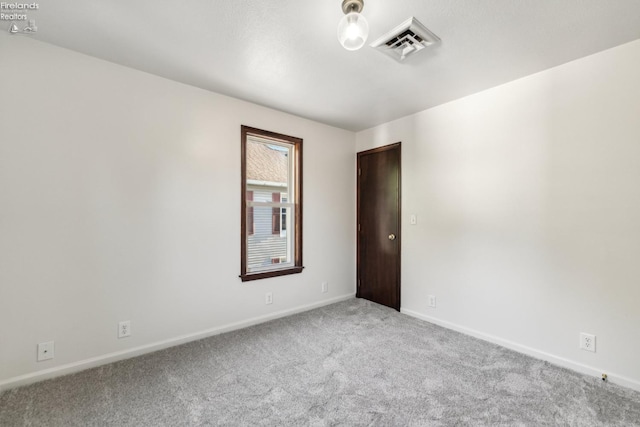 empty room with carpet flooring