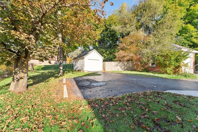 view of yard with an outbuilding and a garage