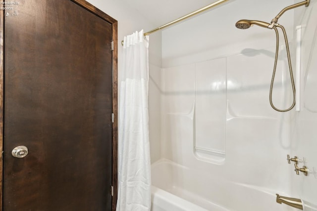 bathroom featuring shower / tub combo with curtain