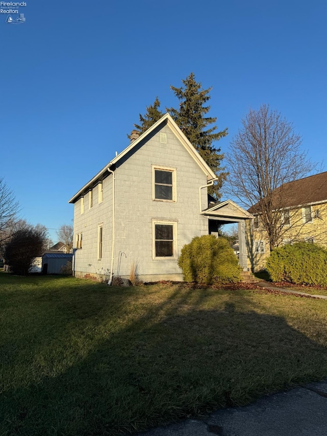 view of property exterior featuring a yard