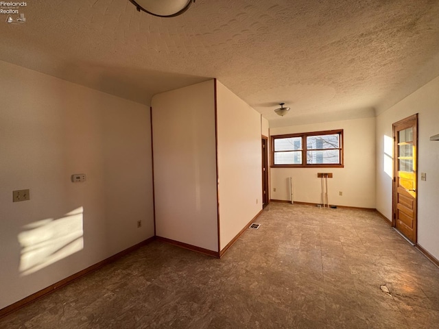 interior space featuring a textured ceiling