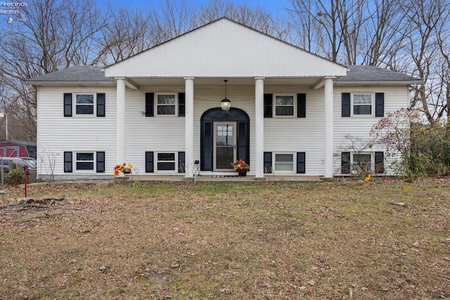 raised ranch featuring a porch