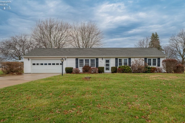 single story home featuring a front yard and a garage