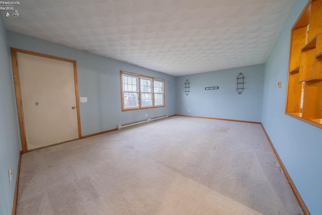 unfurnished room with light carpet and a baseboard radiator