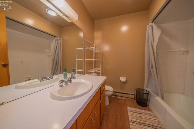 full bathroom featuring shower / bath combination with curtain, vanity, a baseboard heating unit, hardwood / wood-style flooring, and toilet