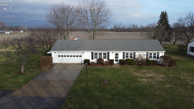 single story home with a front yard and a garage