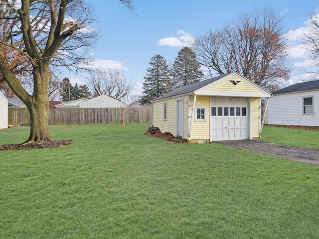 garage featuring a yard