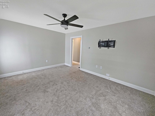 spare room with carpet flooring and ceiling fan