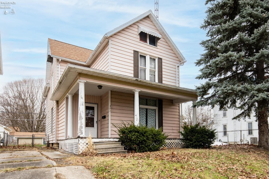 view of front of home featuring central air condition unit