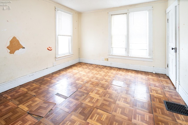 spare room featuring parquet flooring