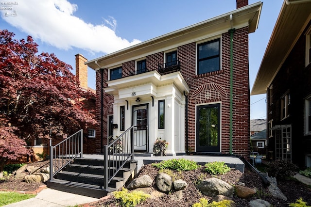 view of front of property with a balcony