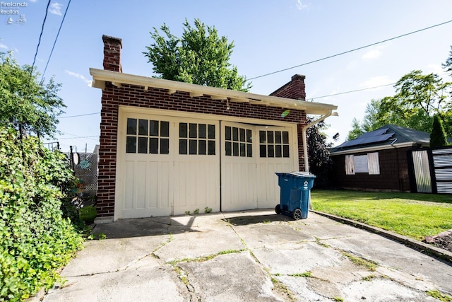 garage with a lawn