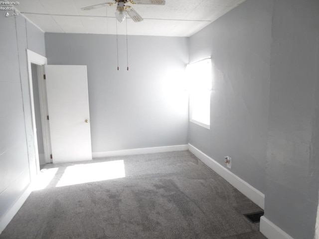 unfurnished room featuring carpet and ceiling fan