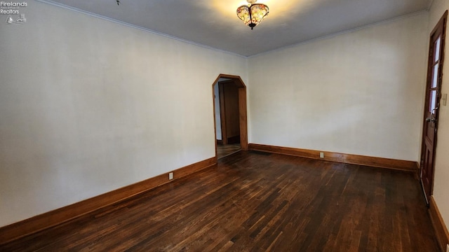 unfurnished room featuring dark wood-type flooring