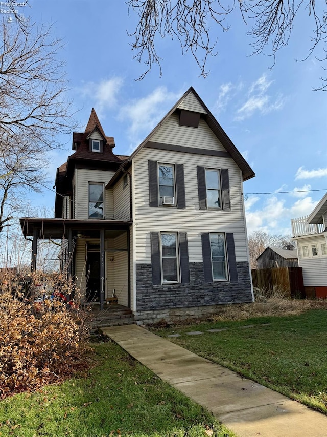 view of front of property with a front lawn