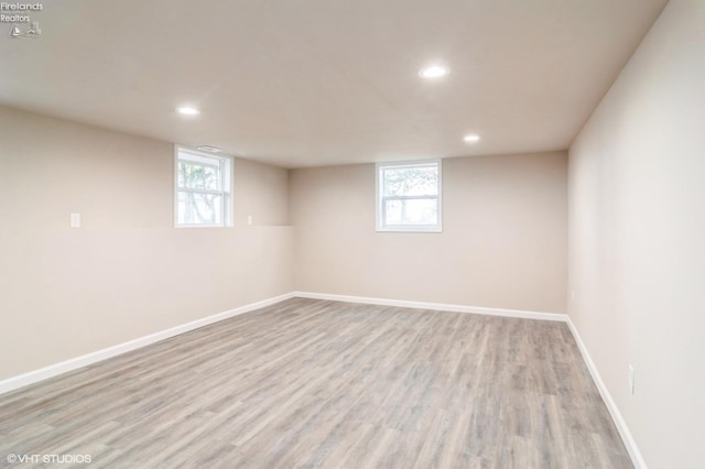 basement featuring light hardwood / wood-style floors