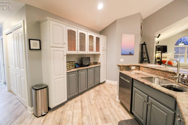 kitchen with gray cabinets, white cabinetry, sink, and dishwasher