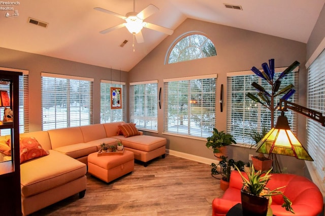 sunroom / solarium featuring ceiling fan and vaulted ceiling