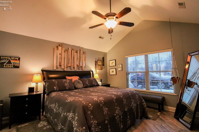 bedroom featuring ceiling fan, wood-type flooring, and vaulted ceiling