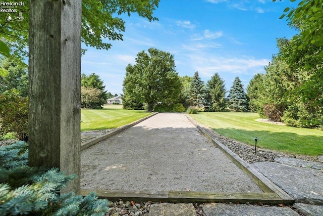 view of property's community with a lawn