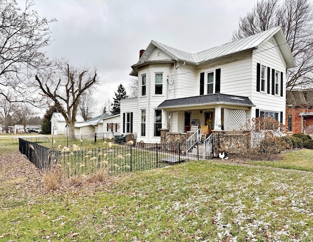 view of front of property featuring a porch and a front lawn