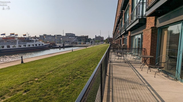 balcony featuring a water view