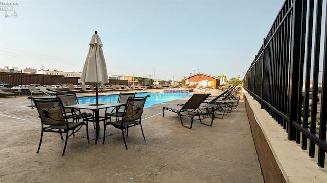 view of swimming pool featuring a patio