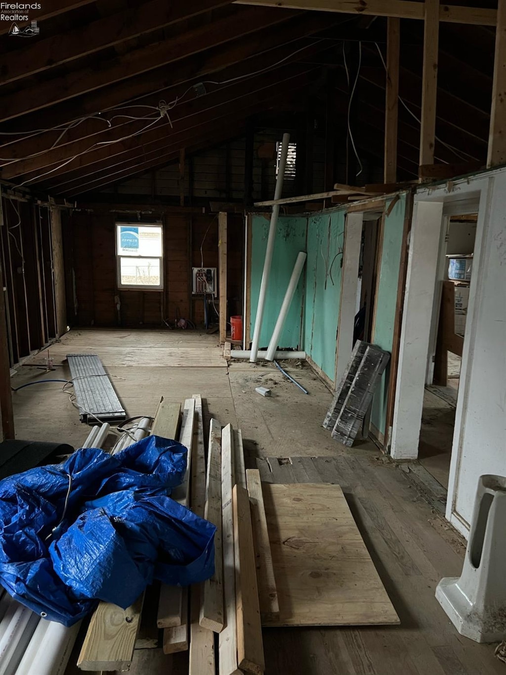 misc room with cooling unit and lofted ceiling