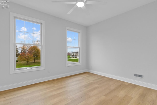 unfurnished room featuring ceiling fan and light hardwood / wood-style floors